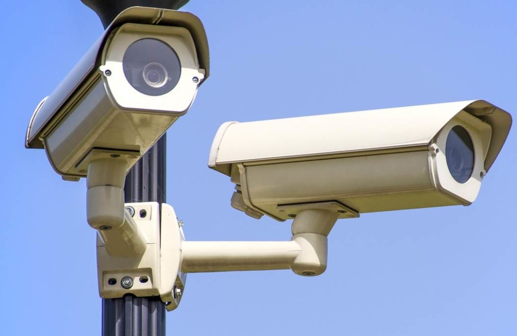 Security cameras are a feature of most buildings an parking lots